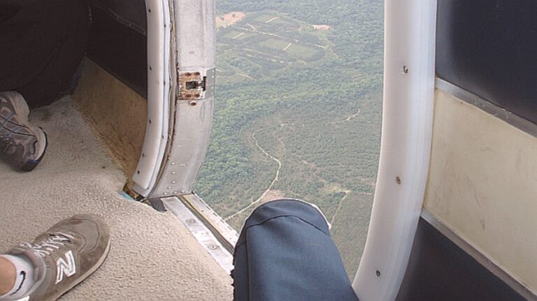 What happens if a door of the aircraft opens during flight?