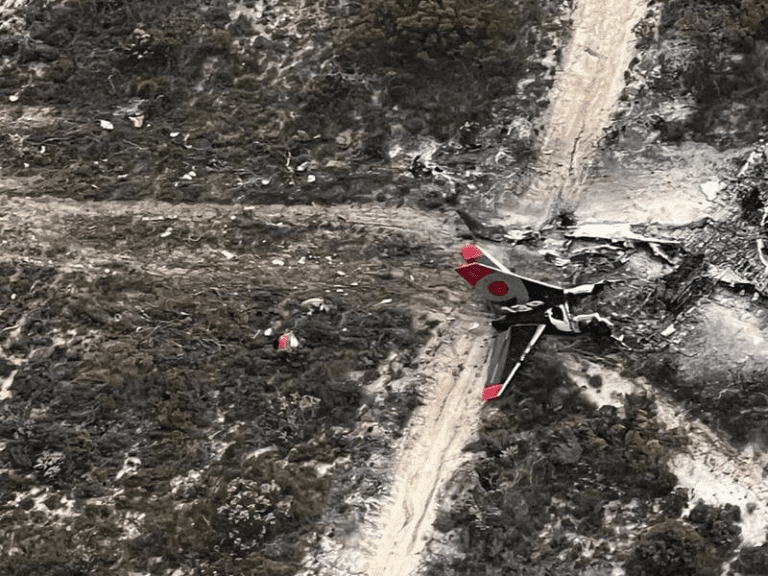 Pilots escape burning firebomber through cockpit window