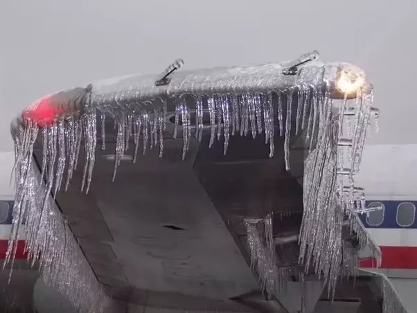 How does ice on an aircraft’s wings and body affect the aircraft?