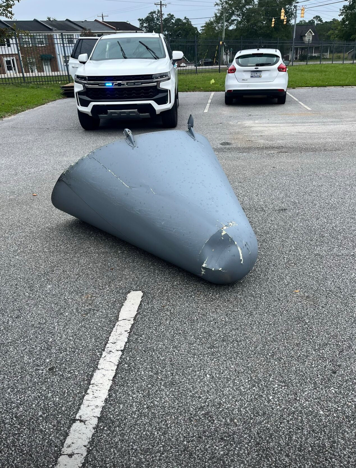 Boeing C-17 Globemaster III aircraft tail cone fell from the sky and landed in the parking lot of Divine Redeemer School of Hanahan, South Carolina