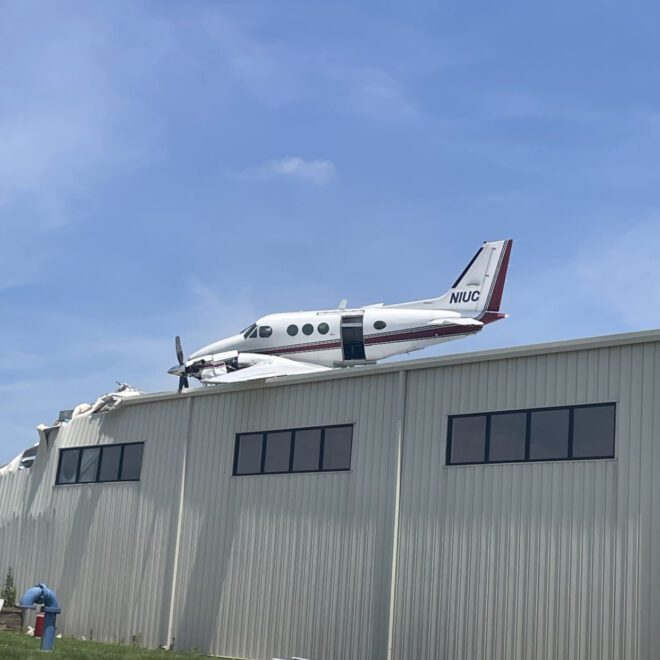 Beechcraft King Air 90 Crash Lands on Hangar at New Century Air Center, Kansas – Two Injured in Twin-Engine Aircraft Accident