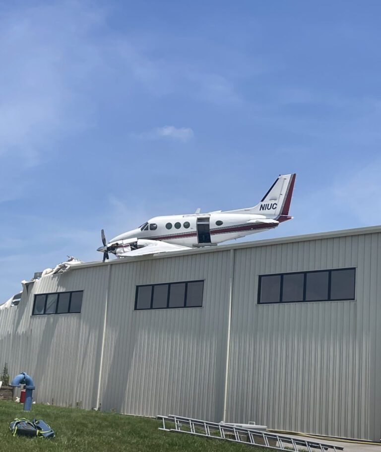 Beechcraft King Air 90 Crash Lands on Hangar at New Century Air Center, Kansas – Two Injured in Twin-Engine Aircraft Accident